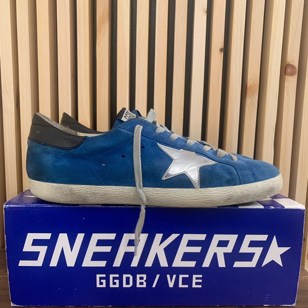 Golden Goose Superstars size 10. Blue suede with silver star accent.